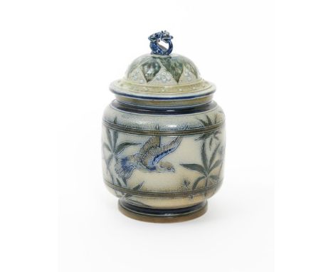 A Martin Brothers stoneware tobacco jar and cover, shouldered cylindrical form, incised with a bird perched amongst tobacco l