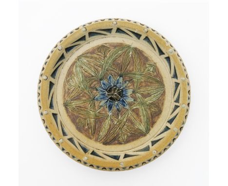 A Martin Brothers stoneware teapot stand by Robert Wallace Martin, circular with serrated edge, incised with a central blue f