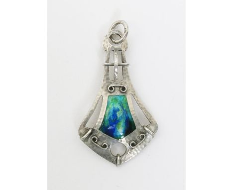 A  Gourdel Vales & Co  Secessionist silver and enamel pendant, shield shape, pierced and cast in low relief with applied scro