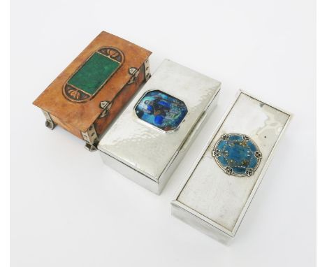 A polished pewter box with enamel roundel in the manner of Jessie M King,  the cedar lined rectangular box with hinged cover,