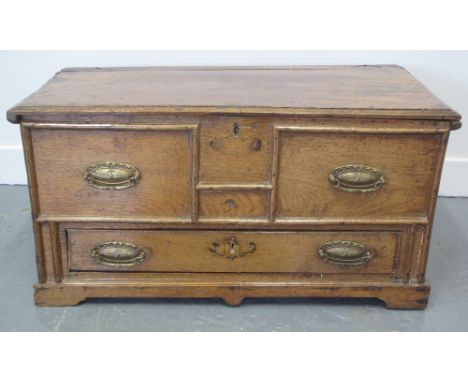 18TH CENTURY WELSH PALE OAK COFFWR BACH, having moulded hinged lid above two moulded dummy drawers and a single pull out draw