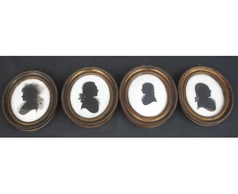 FAMILY GROUP OF FOUR 19TH CENTURY PORTRAIT SILHOUETTES, in matching gilded frames, two labelled verso, 'Striking Likenesses, 