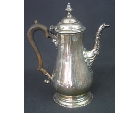 LATE VICTORIAN SILVER COFFEE POT having fluted acorn type finial, circular stepped lid, scroll spout and handle of pot bellie