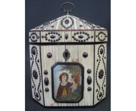 18TH CENTURY IVORY VENEERED, OCTAGONAL SECTION TEA CADDY, overall decorated with steel studded designs, and having painted po