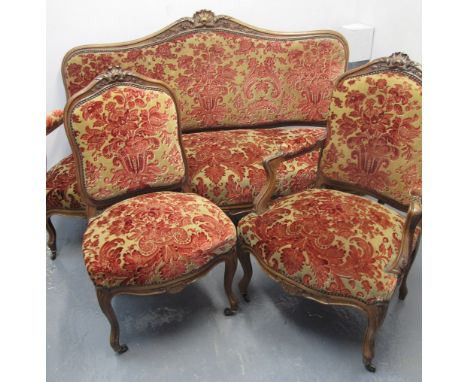 EARLY 20TH CENTURY FRENCH STYLE WALNUT SHOW FRAME PARLOUR SUITE, sofa with shell moulded arch cresting and four side chairs, 