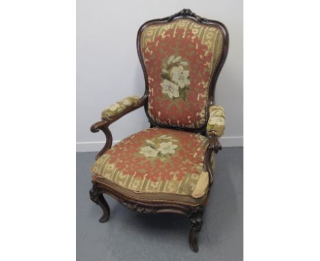 VICTORIAN ROSEWOOD FIRESIDE FRENCH STYLE CHAIR, having carved relief floral and foliate decoration to the top, floral tapestr