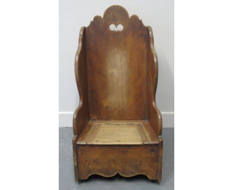 18TH CENTURY STYLE MAHOGANY CHILD'S ROCKING COMMODE ARMCHAIR with arched and pierced back, shaped sides and now fixed seat.  