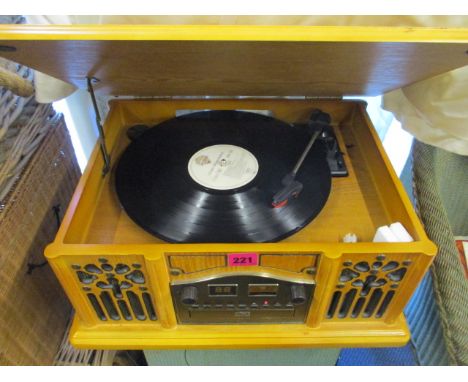 A modern vintage style record player and a Panasonic VHS/DVD player