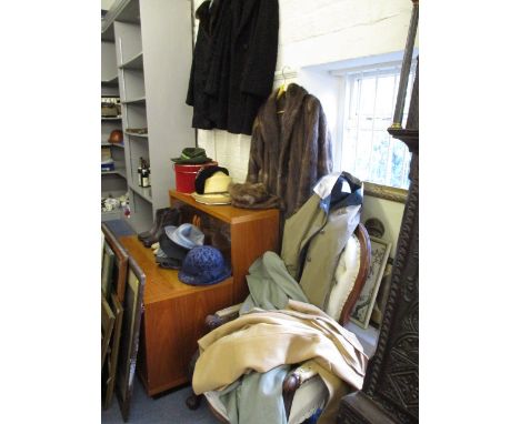 A quantity of mixed clothing to include Astrakan coats, vintage hats, a child's lace dress, shoes and raincoats