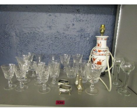 A silver cruet set, Stuart crystal drinking glasses and an oriental porcelain table lamp base