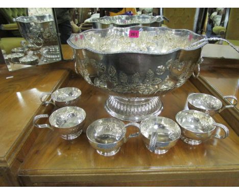 A 20th century silver plate on copper punch bowl, a ladle and six cups