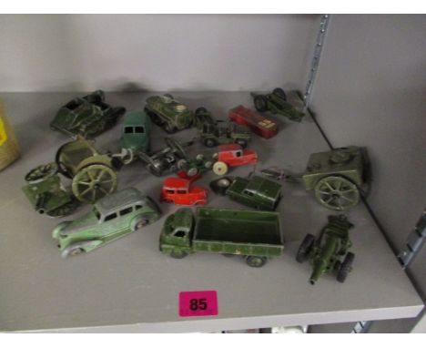 A group of early 20th century Dinky toys, diecast model vehicles to include a Morris Oxford car, a three ton Army Wagon, Brit