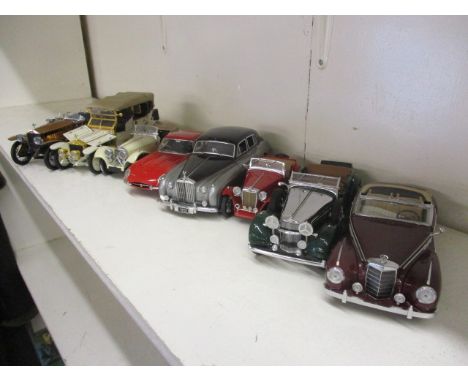 Eight Franklin Mint, diecast model cars to include 1:24 scale model of a Rolls Royce and a 1988 model of an SS Jaguar