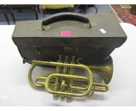 A cased French brass bugle