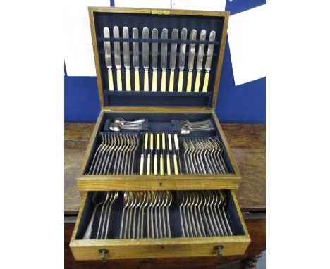 An oak canteen of silver plated and stainless steel cutlery and flatware