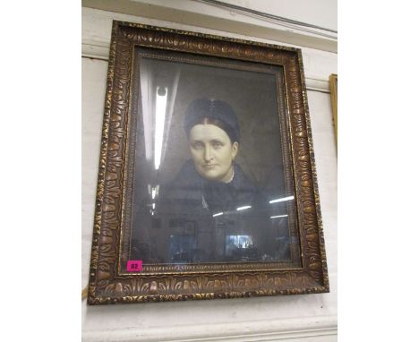 Early 20th century British school - a head and shoulders portrait of a woman with brown hair, wearing a blue hat and coat, oi