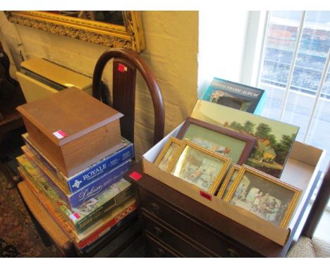 A gilt wall mirror, an oval teak mirror, mixed pictures, vintage jigsaws and a small oak box