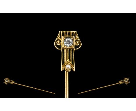 14ct Gold Stick Pin Circa 1910-1930 set with gemstone and seed pearl. 1.6 grams. Decorative Deco style top, please see images
