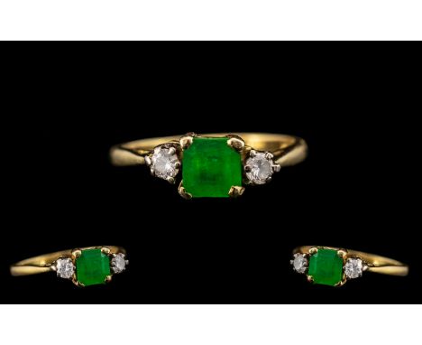 18ct Gold - Attractive Emerald and Diamond Set 3 Stone Ring. Hallmark London 1978. The Square Shaped Faceted Emerald of Good 