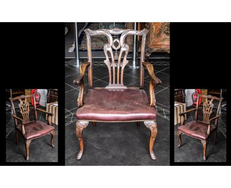 A Chippendale Georgian Style Carver Armchair, leather padded seat with carved back rest and moulded arms with acanthus carved