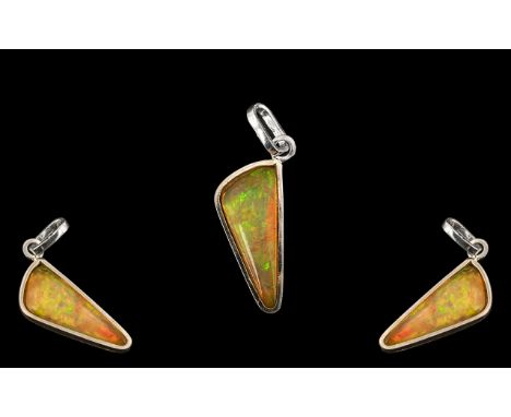 Ethiopian Natural Orange Fire Opal, Wonderful Colours. 4.92 cts Weight - 0.88 grams. Measurements 23.3 x 8.9 x 3.8 mm. 