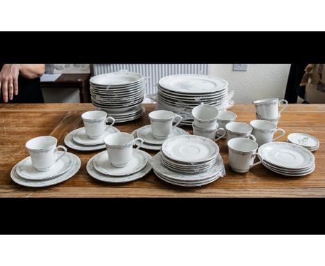 Large Dinner/Tea Service in Fine Porcelain, in white ground with delicate floral trim, comprising:  12 dinner plates; 12 side