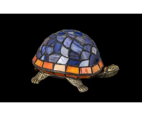 Tiffany Style Table Lamp in the Form of a Tortoise.  Shade in blue and coral coloured glass.  Measures 9" long and 6" wide.