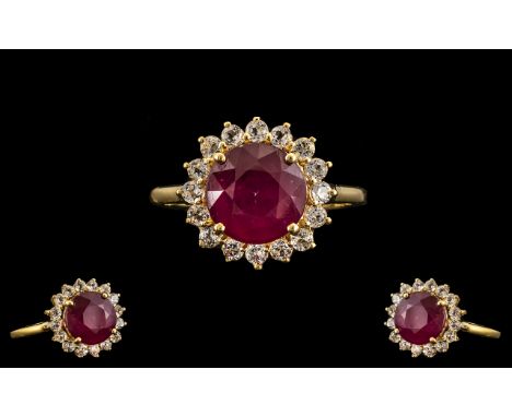 Ruby and White Topaz Halo Ring. A Round Cut Ruby of 5.5 cts, and of Good Bright Colour, Framed by 1ct of Sparkling White Topa