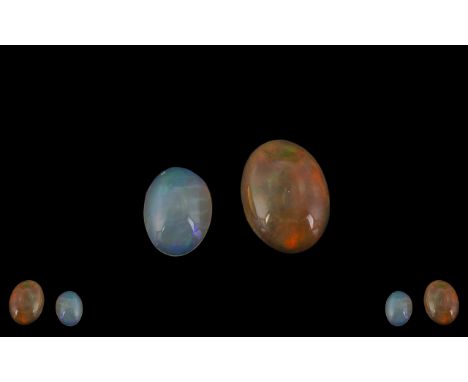 Ethiopian - Loose Natural Opals  ( 2 ) In Total. Comprises 1/ 2.99 cts, Measurements 14.3 x 10.6 x 5.2. 2/ Milky Blues Oval S