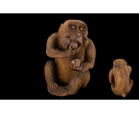 Japanese Meiji Period Carving of a Monkey Eating a Peach, of unusually large size, with finely detailed carving and chisel wo