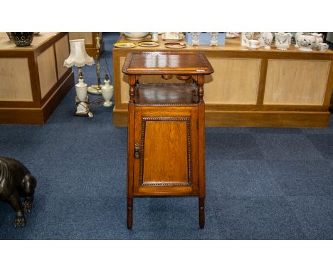 Early 20thC Oak Gramophone Pedestal Table/Stand the fitted top with sliding top with hinged well for needles.  Above a storag