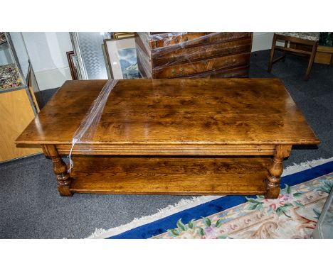 A Quality Oak Plank Coffee Table of traditional pegged construction. Turned supports with two frieze drawers. With lower stor