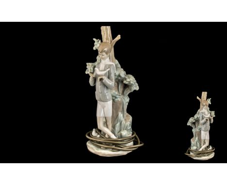 Lladro Handpainted Figural Porcelain Lamp - 'Boy Holding a Dove' standing by a tall tree. Model no. 4508, issued 1969-1985. H