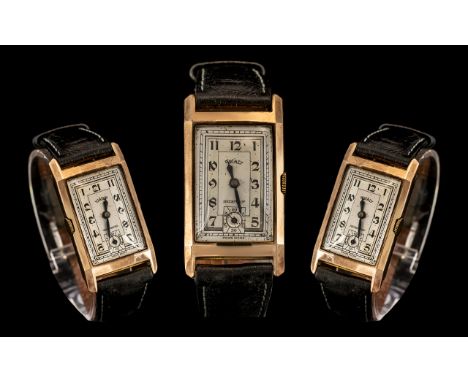 Art Deco Rotary Wristwatch 9ct Gold Rectangular Slightly Convex Faceted Case On A Black Leather Strap, Silvered Dial With Ara