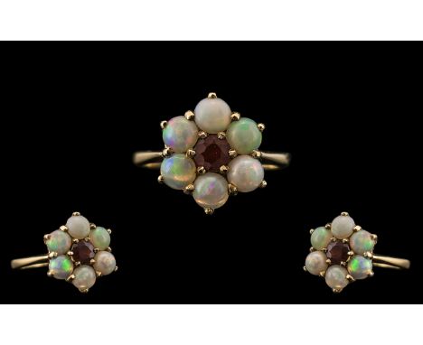 Ladies 9ct Gold Opal and Garnet Set Dress Ring, Flower head Setting. Fully Hallmarked for 9.375. Ring Size P. All Aspects of 
