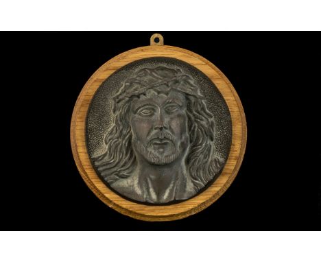 A Bronze Roundel Cast with the Head of Christ with thorns. 7 inches in diameter.