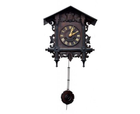 A BLACK FOREST CUCKOO CLOCK WITH GRIDIRON PENDULUM, LATE 19TH/EARLY 20TH CENTURY, 38CM H