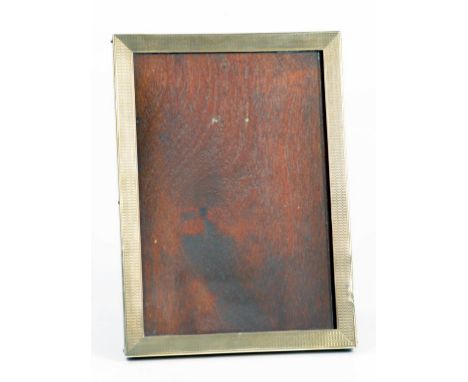 A GEORGE V SILVER PHOTOGRAPH FRAME, ENGINE TURNED, 17CM X 12CM, BIRMINGHAM 1931