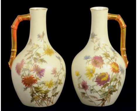 A PAIR OF ROYAL WORCESTER BAMBOO HANDLED OLD IVORY EWERS, DECORATED WITH WILD FLOWERS, 17CM H, PRINTED MARK, CIRCA 1880