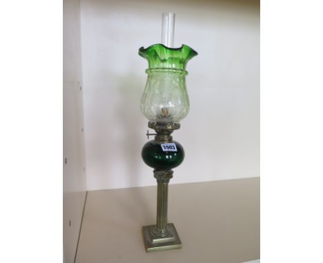 A pipe oil lamp with green etched glass shade and green glass font, 49cm tall, small chips to base of shade, and a small brea