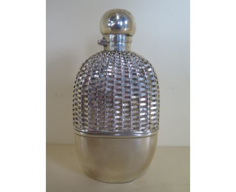 A silver and glass hip flask with hunting top and lattice cover, London 1888/9 Maker H.T.B, 15cm height, minor dents to top, 