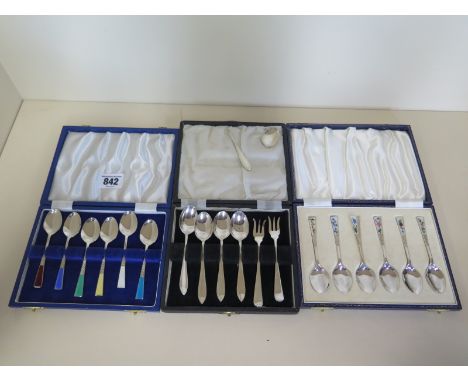 Two boxed sets of enamel and silver teaspoons in good condition and five silver spoons, one spoon broken, and two silver fork