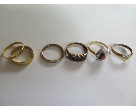 Two x 22ct yellow gold band rings, approx 4.7 grams, a 9ct gold ring approx 1.3 grams, 2 unmaked gilt metal rings and a silve