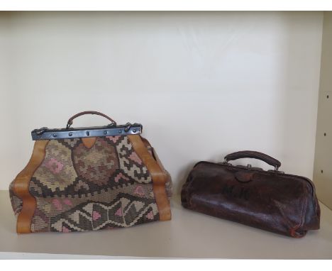 A Vintage leather Gladstone bag, 40cm long and a Victorian style carpet bag, 43cm long, both in usable condition 