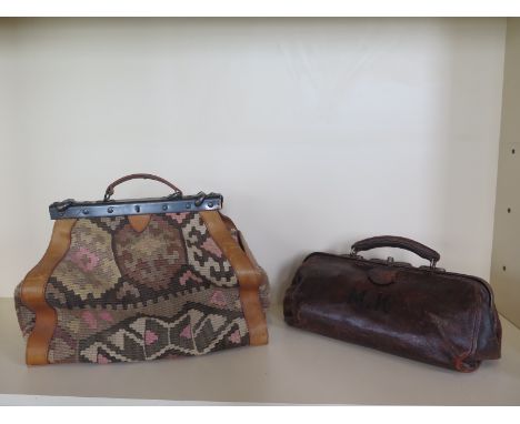 A Vintage leather Gladstone bag, 40cm long and a Victorian style carpet bag, 43cm long, both in usable condition 