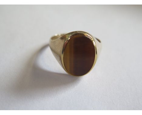 A hallmarked 9ct yellow gold tigers eye quartz signet ring, size Z - approx 6.2 grams - has been resized, minor usage marks, 
