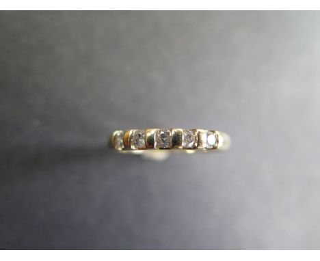 A 9ct yellow gold five stone diamond ring - size N, approx 2.2 grams - diamonds bright minor usage good condition - marked 9c