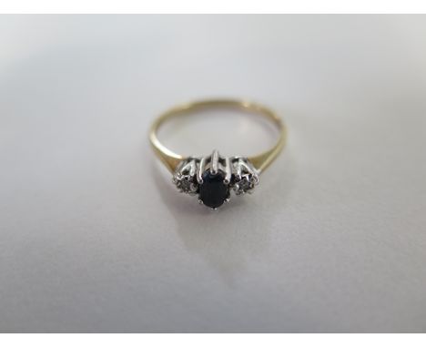 A 9ct yellow gold sapphire and diamond ring, size N, hallmarked, generally good condition, approx 1.7 grams 