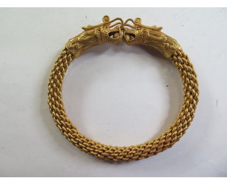A gilt dragon bangle - 10cmx10cm - some ageing finish to gilt - otherwise good 