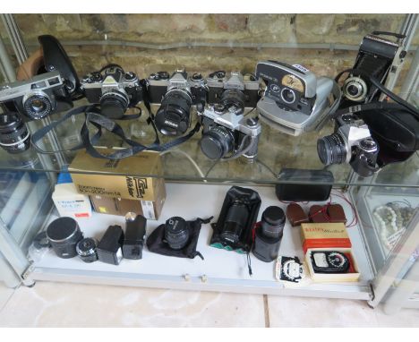 A good collection of camera equipment to include three Nikon 35mm SLR's a Pentax ME Super, a Fujica STX IN, Canon Canonet, Po